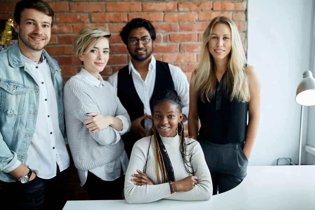 Young employees in office setting